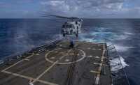 MH 60R Sea Hawk helicopter training on destroyer