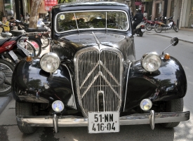 old black antique automobile parked on street vietnam 9115a