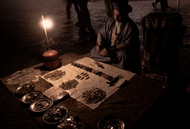 old man selling metal goods at night Djemaa el Fna Marrakech 435