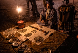 old man selling metal goods at night Djemaa el Fna Marrakech0435