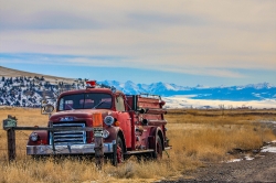 old-red-truck-on-montana-roadold-red-truck-on-montana-road
