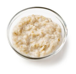 ooked oatmeal in clear bowl