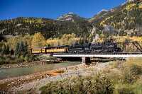 panoramic view of steam train on  trestle bridge 