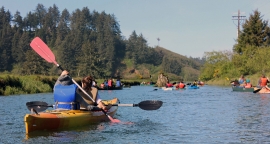 people on canoes on Guided water tours of Siletz Bay and Nestucc