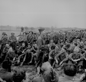 Pfc Mickey Rooney imitates some Hollywood actors for an audience of Infantrymen