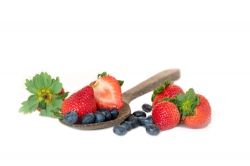 photo image wooden spoon blueberries strawberries on white backg
