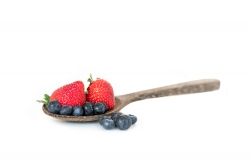 photo image wooden spoon with strawberries and blueberries white