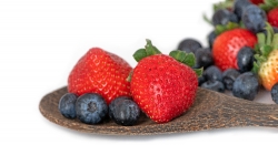 photo image wooden spoon with strawberries and blueberries white