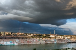 roiling-clouds-and-a-rainbow-appear-above-the-skyline-of-pueblo-
