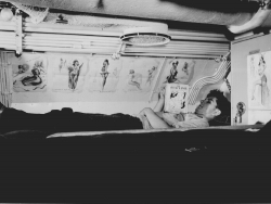 Sailor reading in his bunk