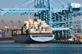 ship filled with containers near cranes