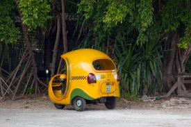 small yellow taxis Havana cuba