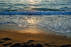 sunet reflectionn on the ocean in myconos greece
