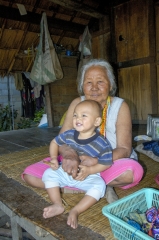 thai grandmother holding a young boy