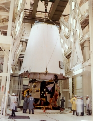 third stage adapter is lowered into place over the lunar module