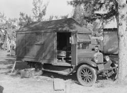Tom Tom Herb Tonic truck in transient labor cabin and trailer ca