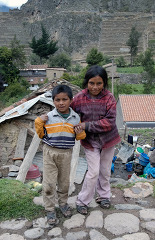 Two Peruvian children looking at the camera