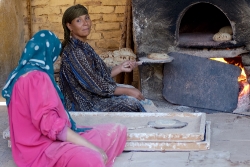 two-egyptian-woman-baking-breat-outdoor-oven-5053-photo-image