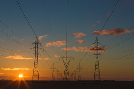 view of electric power lines at sunset