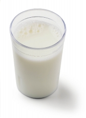 whole milk in clear glass