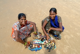 Woman Selling beaded necklaces on the Beach Goa India