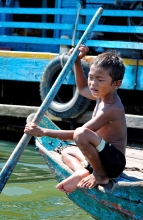 Young boy in Boat near Floating Village of Chong Khneas