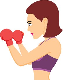 serious female boxer wiearing gloves practicing boxing clipart