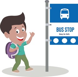 smiling boy looking at bus stop sign