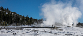 Visitors on winter snow covered Geyser Hill in