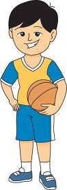 smiling child standing holdinbg a basketball