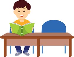 student sitting at desk reading book in classroom