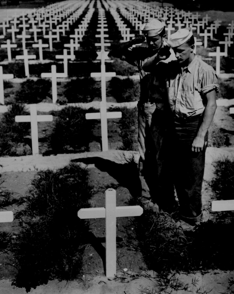  row upon row of white crosses in an American cemetery 