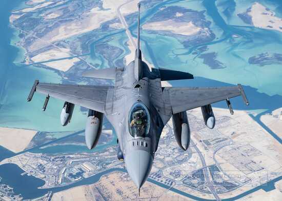 Air Force F-16 Fighting Falcon flies over the U.S. Central Comma