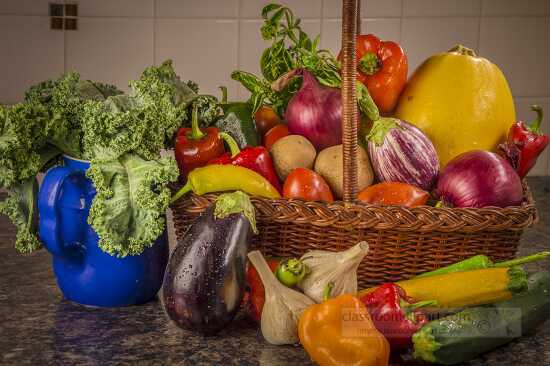 Basket with fresh vegetables and herb