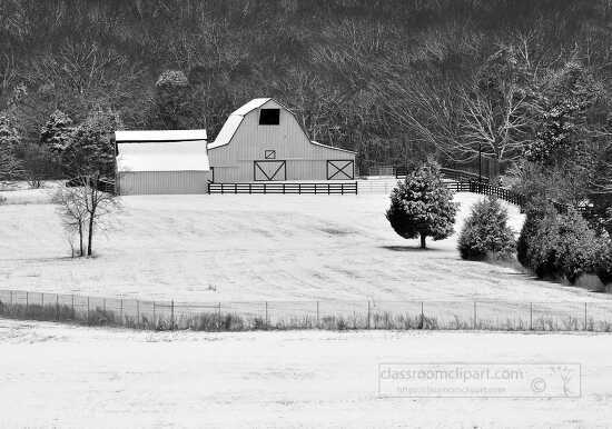 black and white farm scene covered in snow