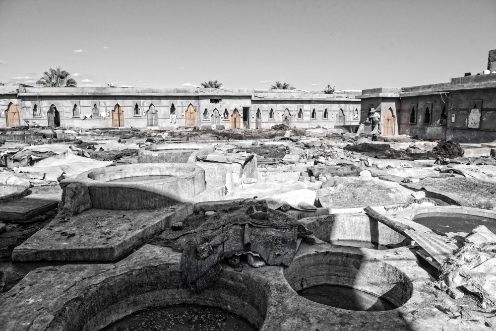 black white photo of stone vessels tannery marrakesh morocco ima