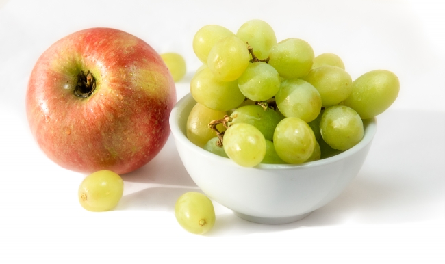 Bowl Green Grapes With Single Red Apple Wood Background Photo 