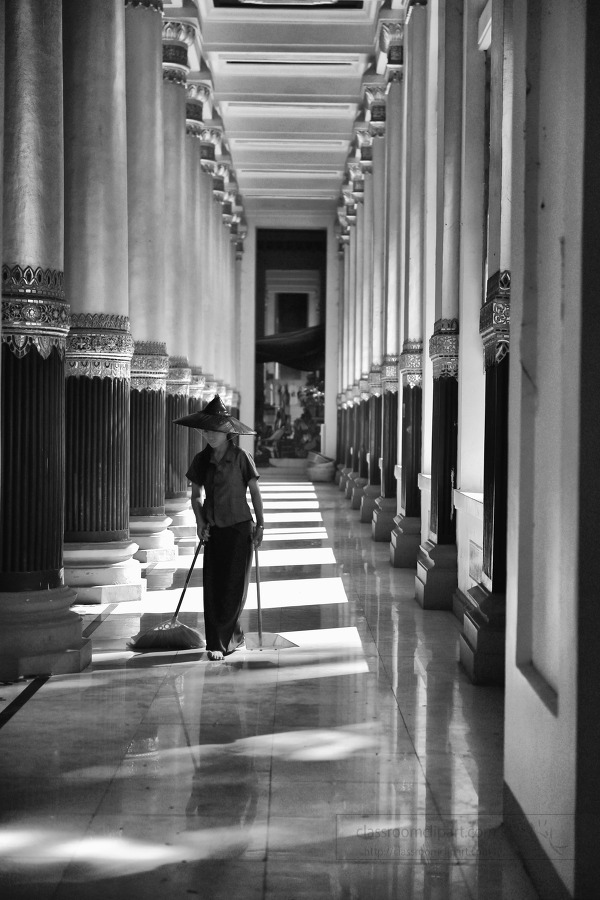 Burmese Woman cleaning floor Shwedagon Pagoda in Yangon Myanmar