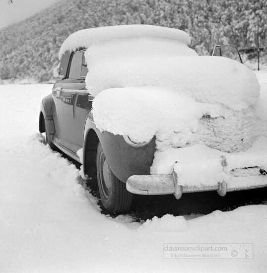 Car covered with snow after fall blizzard in Aspen Colorado 1941