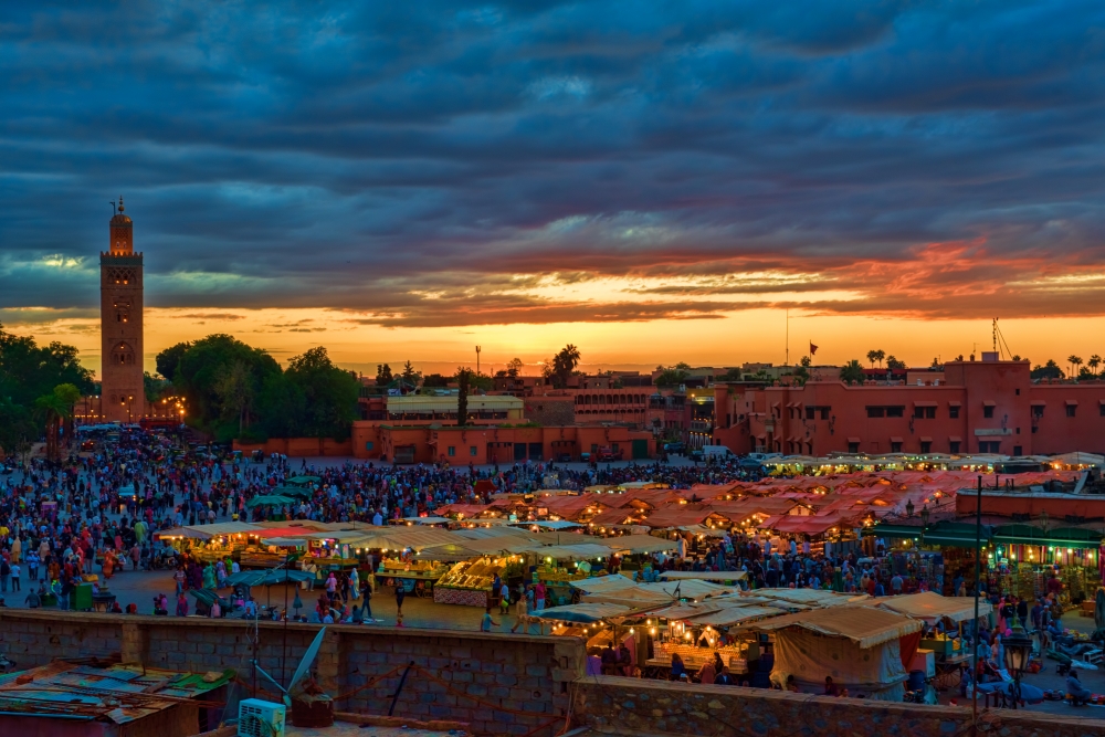 Djamaa El Fnathe main square in Marrakesh at sunset photo image 