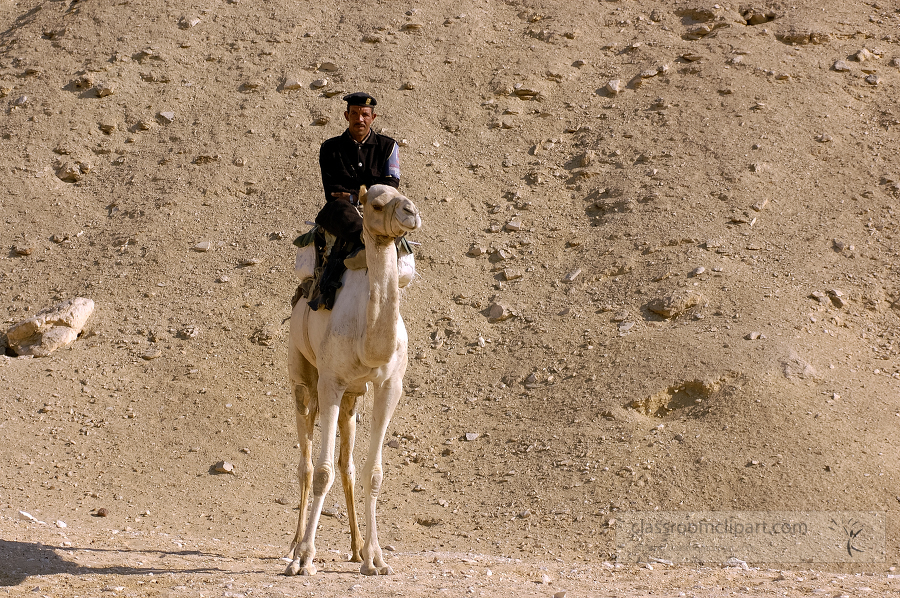 egyptain guard wearing a uniform sits on a camel