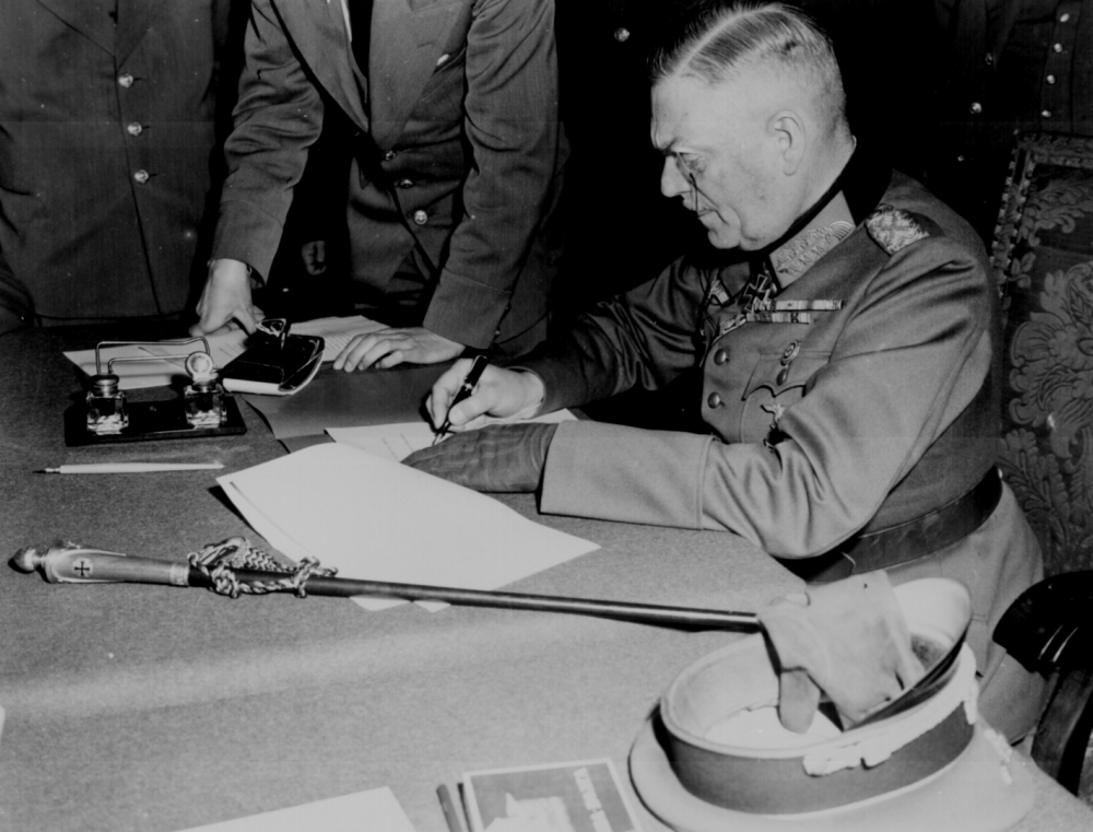 Field Marshall Wilhelm Keitel signing the ratified surrender terms for the German Army