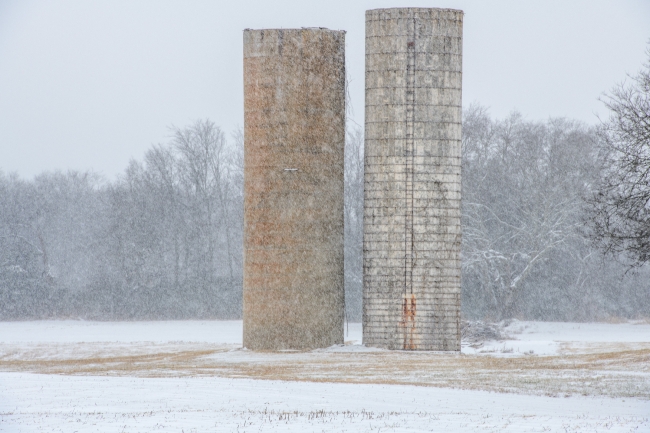 grain silos on an snowy day
