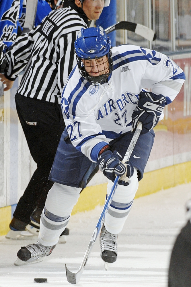 ice hockey player after puck