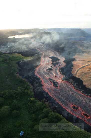 Lava from fissure glowing orange throughout its journey