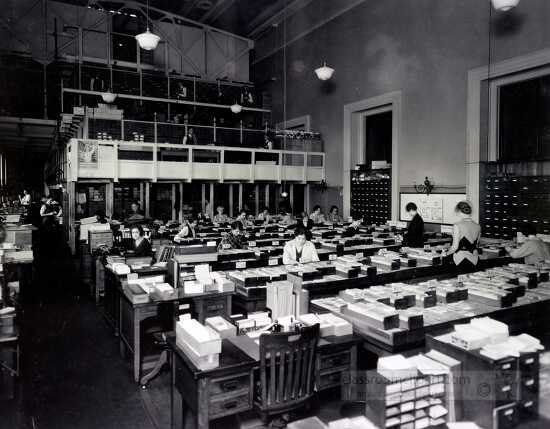 Librarians working with catalog cards in the Processing Departme