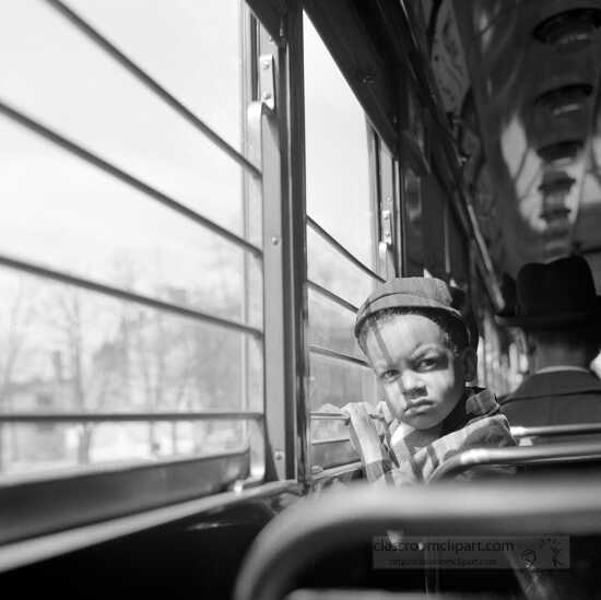Little boy riding on a streetcar  Washinton DC 1939