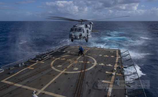 MH 60R Sea Hawk helicopter training on destroyer