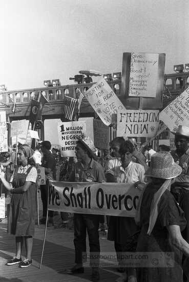 Mississippi Freedom Democratic Party holding signs in front of t