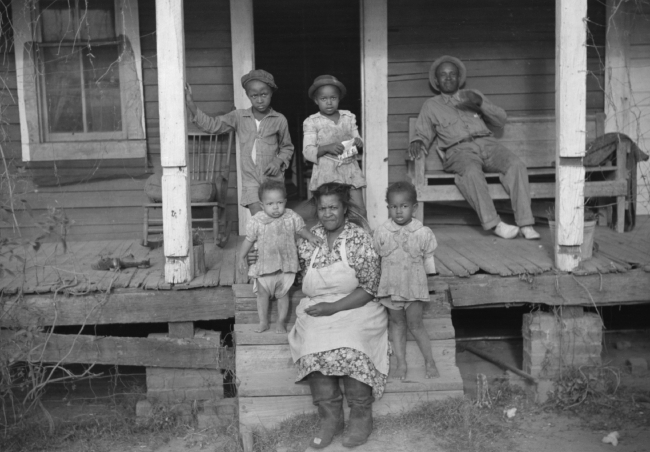 One of tenant families on their porch